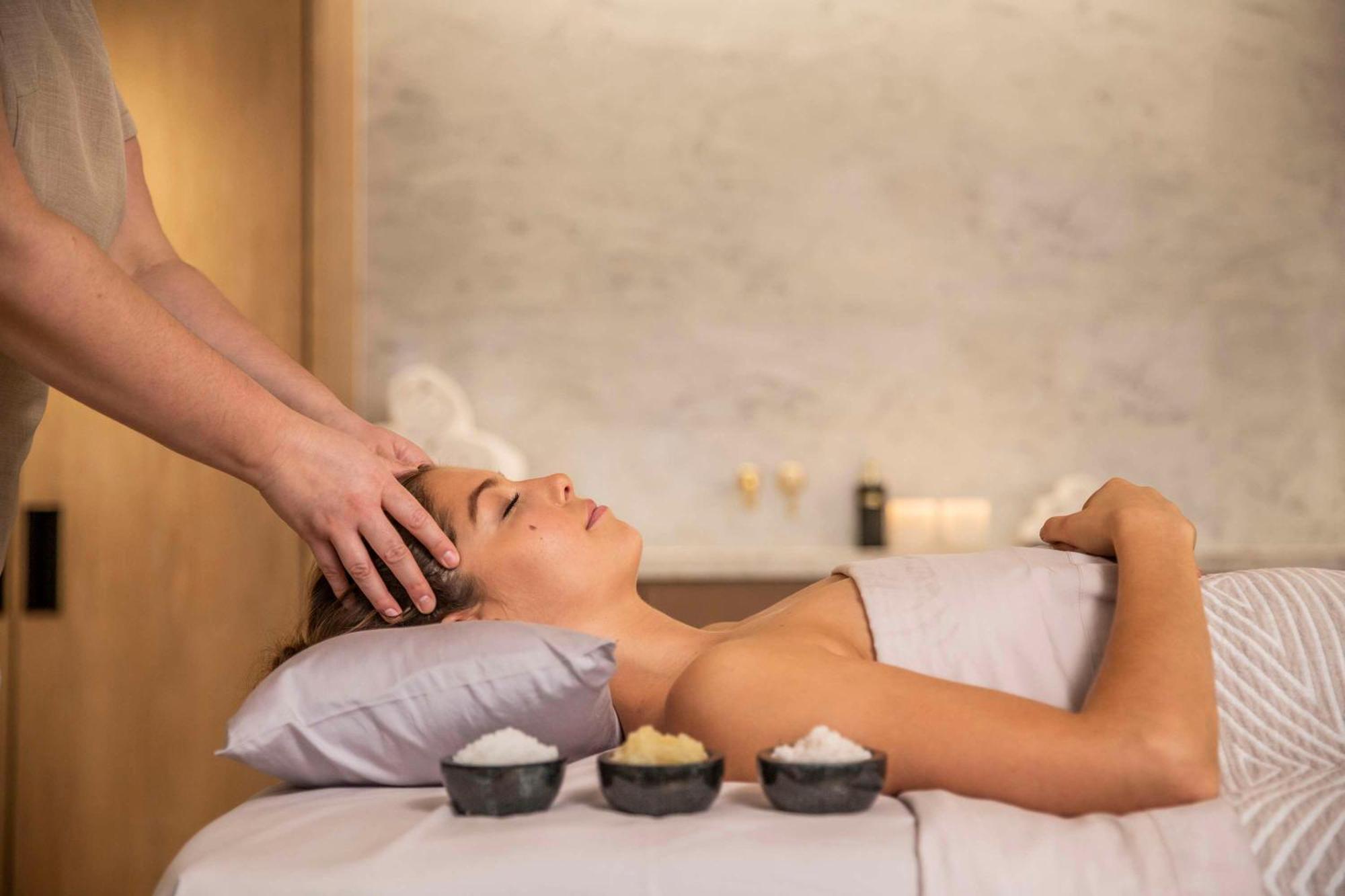 Park Hyatt Auckland Hotel Exterior photo A woman receiving a hot stone massage